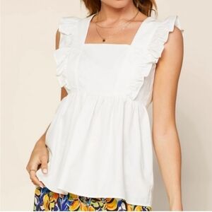 Skies are blue white ruffled tie back tank